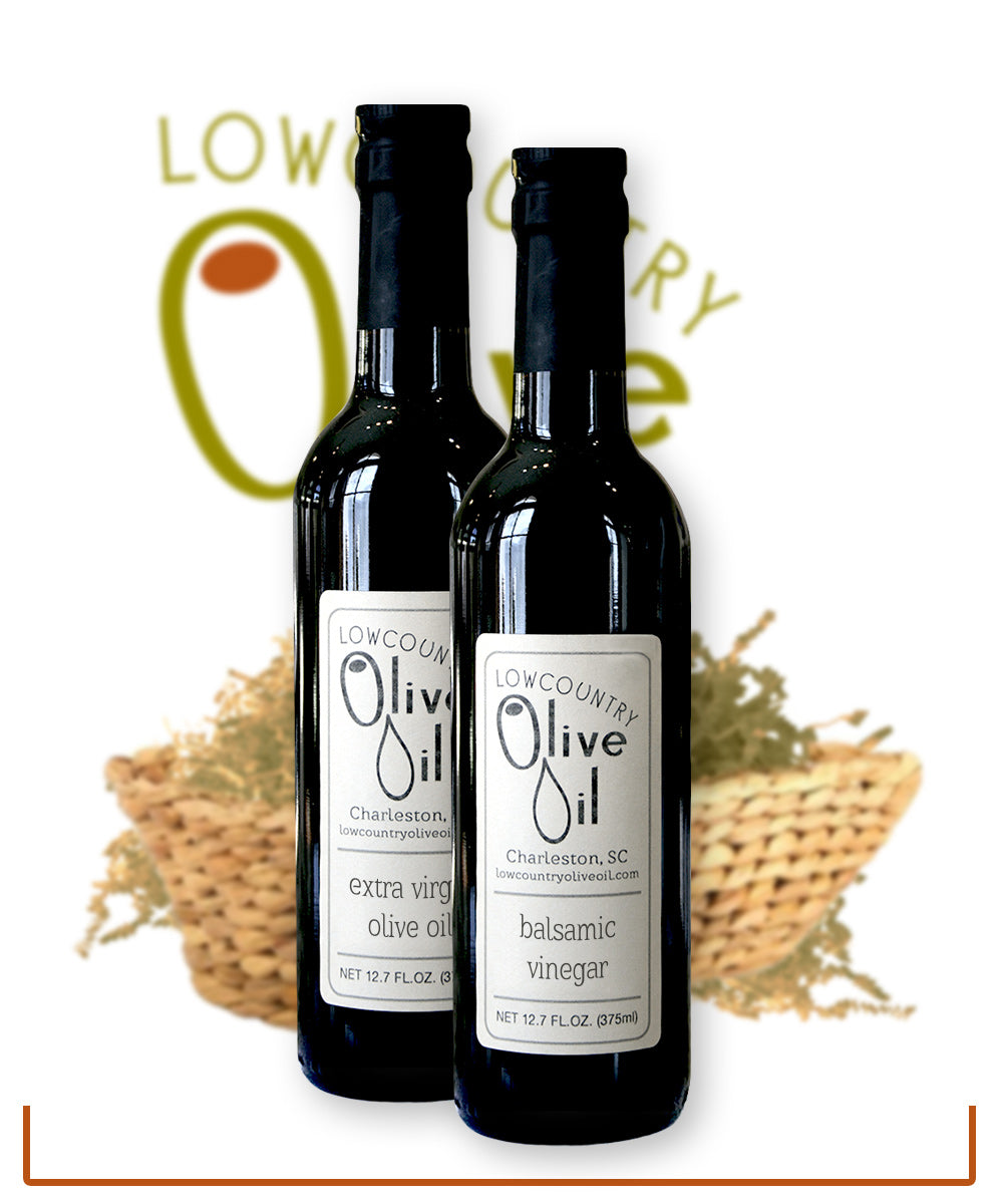 2 12 ounce bottles of oil or vinegar in decorative gift basket